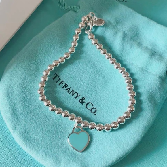 Tiffany & Co. Accessories - Tiffany & Co. Silver Bracelet with Aqua Heart Charm